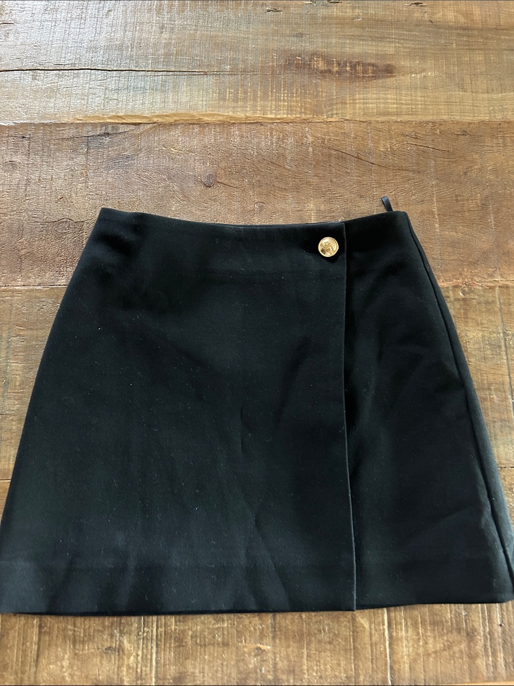 Babaton Black Mini Wrap Skirt with Gold Accent